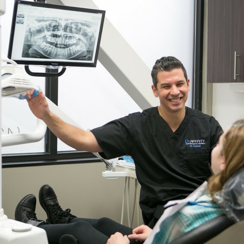 Dr. Youssef restoring a patient's smile with CEREC same-day crowns